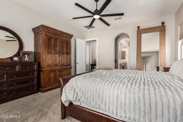 3824 E Parkside Ln, Phoenix, AZ 85050 - bedroom with light colored carpet, arched walkways, and a ceiling fan