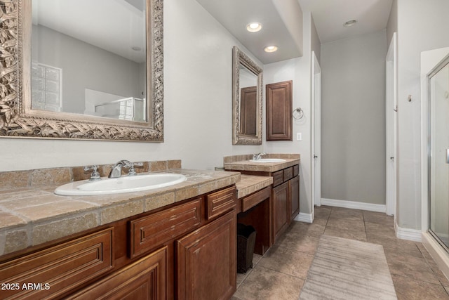 3824 E Parkside Ln, Phoenix, AZ 85050 - bathroom with a stall shower, two vanities, and baseboards