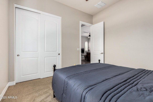 3824 E Parkside Ln, Phoenix, AZ 85050 - bedroom with light colored carpet, a closet, and baseboards