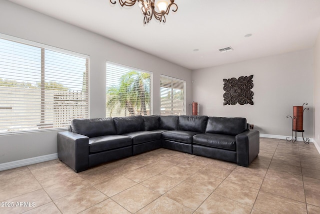 3824 E Parkside Ln, Phoenix, AZ 85050 - living room featuring light tile patterned floors, baseboards, and a chandelier