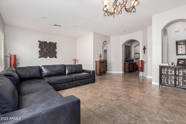 3824 E Parkside Ln, Phoenix, AZ 85050 - living area with arched walkways, a chandelier, and baseboards