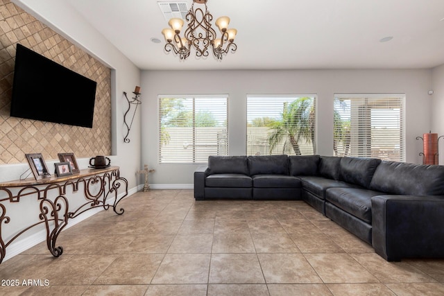 3824 E Parkside Ln, Phoenix, AZ 85050 - living room featuring baseboards, light tile patterned floors, and a chandelier