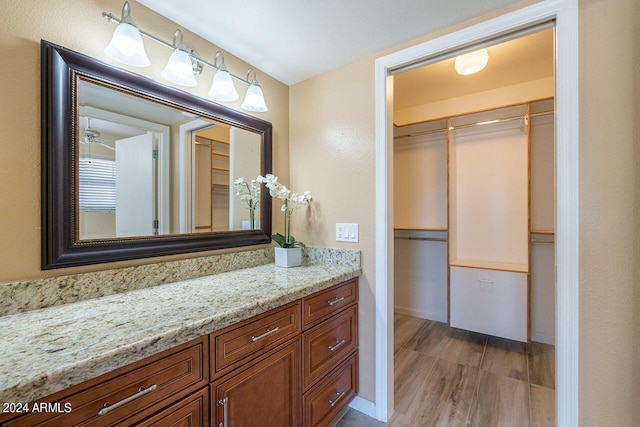 bathroom featuring vanity and hardwood / wood-style floors