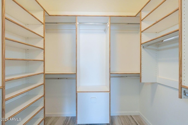 spacious closet with light wood-type flooring