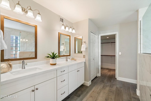 bathroom with vanity and wood-type flooring