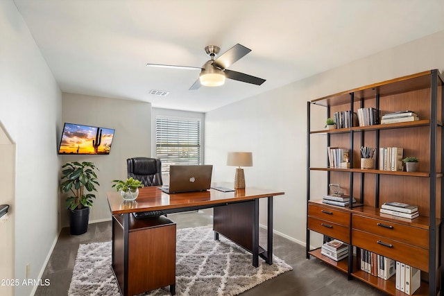 carpeted office with ceiling fan