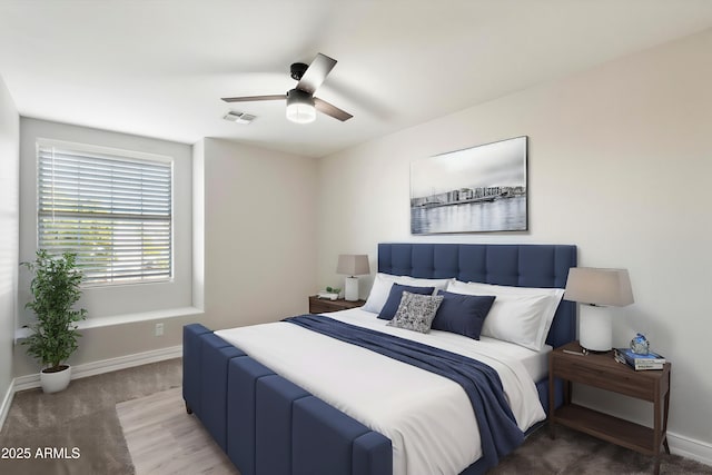 carpeted bedroom with ceiling fan