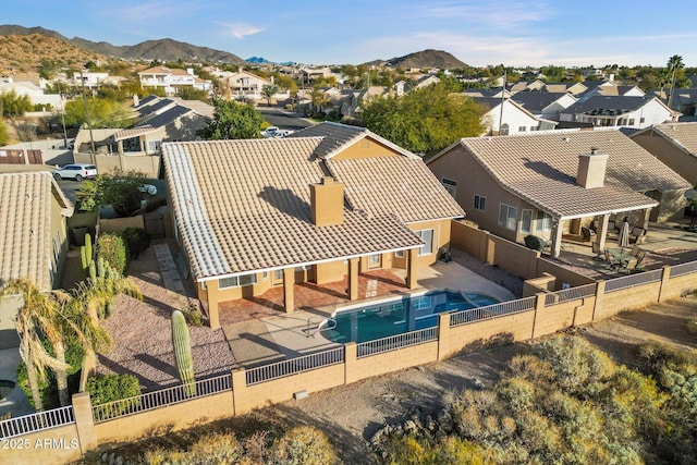 birds eye view of property with a mountain view