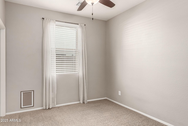 empty room featuring baseboards, carpet, and ceiling fan