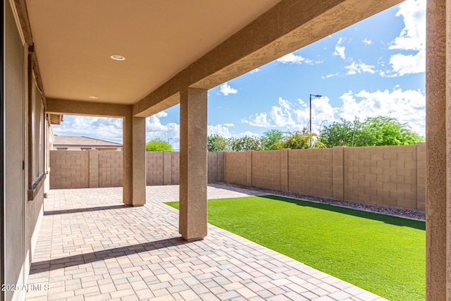 view of patio with a fenced backyard