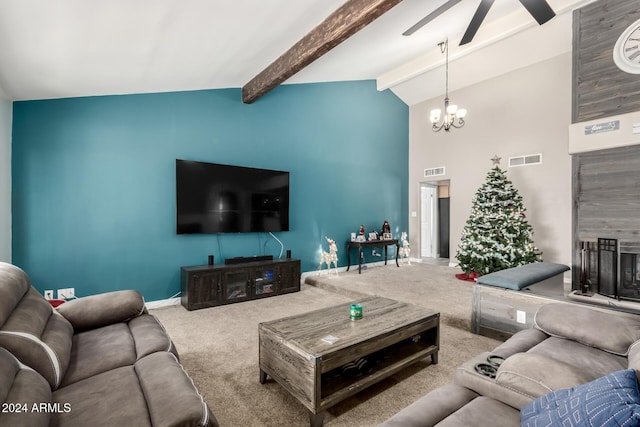 living room with carpet, high vaulted ceiling, ceiling fan with notable chandelier, beamed ceiling, and a tiled fireplace