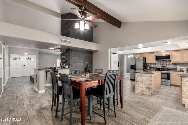 dining room featuring beamed ceiling, ceiling fan, high vaulted ceiling, and light hardwood / wood-style flooring