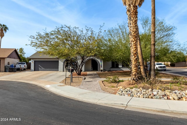 obstructed view of property featuring a garage