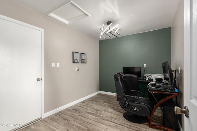 office area with light hardwood / wood-style floors