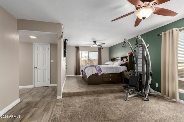 bedroom with ceiling fan and hardwood / wood-style flooring