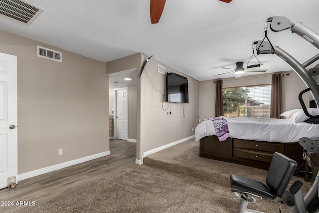 bedroom with ceiling fan and dark wood-type flooring