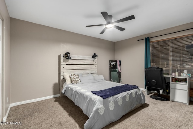 bedroom with ceiling fan and light colored carpet