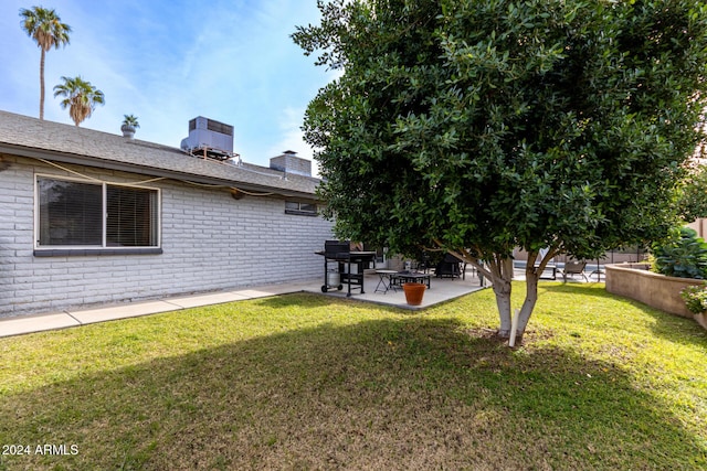 view of yard with a patio and central AC