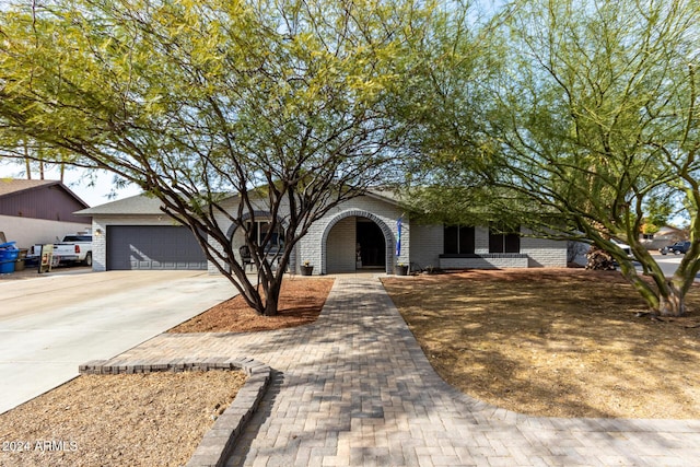 ranch-style house featuring a garage