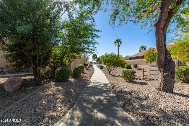 view of property's community featuring fence