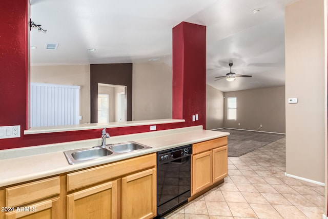 kitchen with ceiling fan, dishwasher, sink, vaulted ceiling, and light tile patterned floors