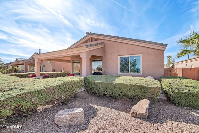 exterior space with fence and stucco siding