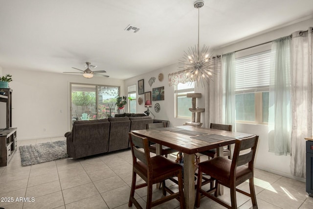 4269 W Coneflower Ln, San Tan Valley, AZ 85144 - dining room with light tile patterned floors, visible vents, and ceiling fan with notable chandelier