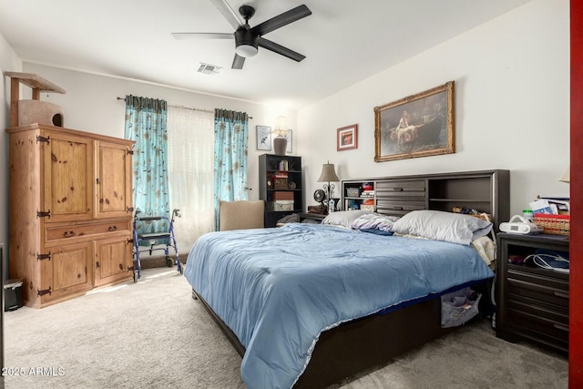 4269 W Coneflower Ln, San Tan Valley, AZ 85144 - bedroom with light carpet, a ceiling fan, and visible vents