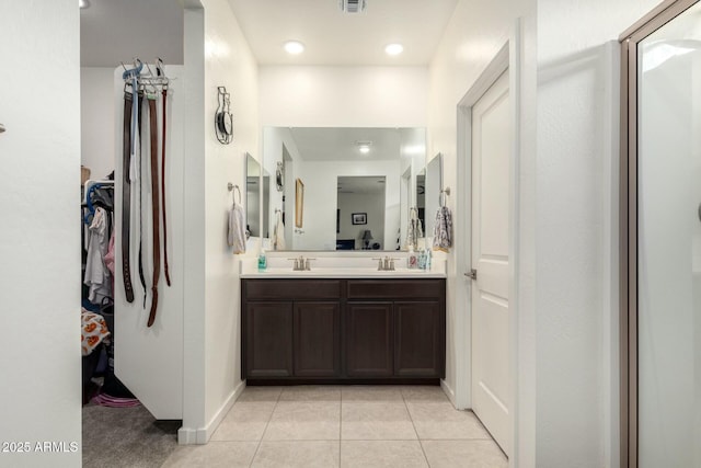 4269 W Coneflower Ln, San Tan Valley, AZ 85144 - full bath with double vanity, a sink, tile patterned flooring, and a spacious closet