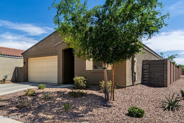 4269 W Coneflower Ln, San Tan Valley, AZ 85144 - view of front of home featuring concrete driveway, stucco siding, an attached garage, and a tile roof