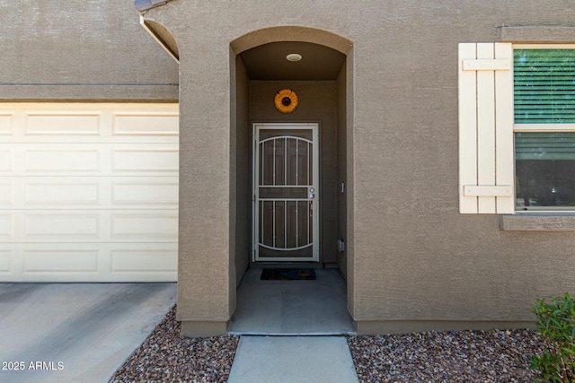 4269 W Coneflower Ln, San Tan Valley, AZ 85144 - entrance to property with a garage and stucco siding