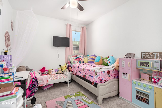 bedroom featuring light carpet and ceiling fan