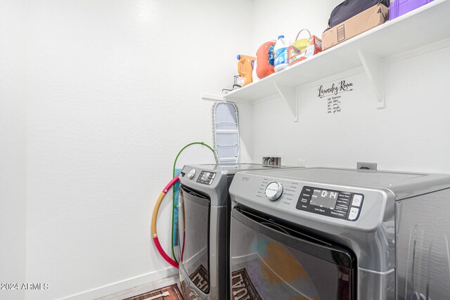 laundry room featuring hardwood / wood-style flooring and independent washer and dryer