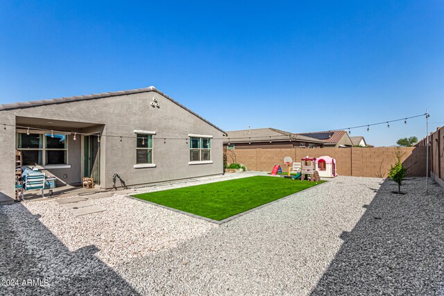 rear view of house featuring a patio