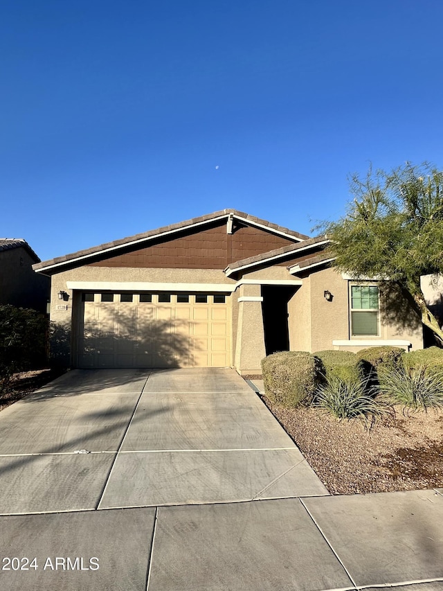 ranch-style home with a garage