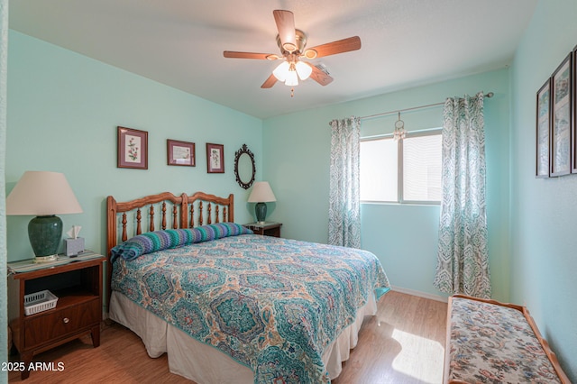 bedroom featuring ceiling fan and wood finished floors