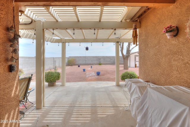 view of patio / terrace with fence and a pergola