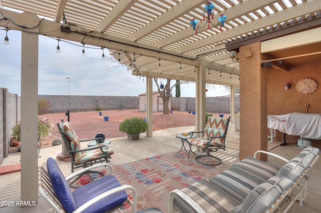 view of patio featuring an outbuilding, a fenced backyard, and a storage shed