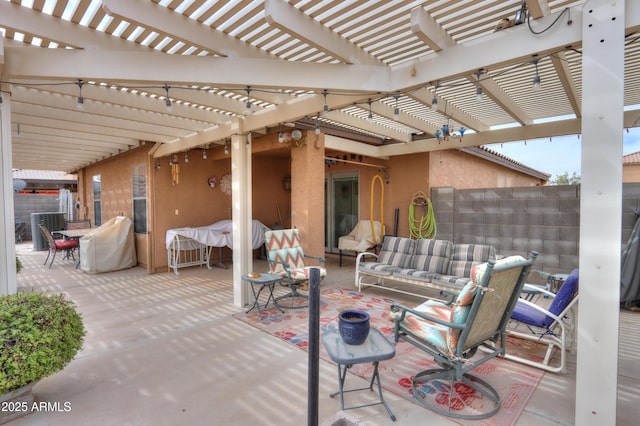 view of patio / terrace with an outdoor living space, fence, and a pergola