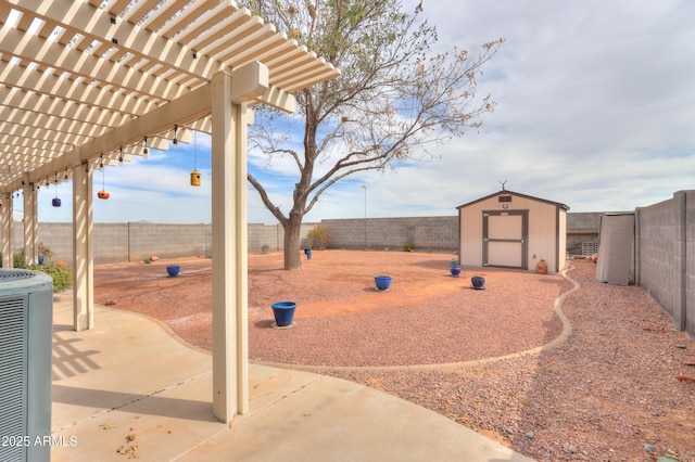 view of yard featuring an outdoor structure, central AC unit, a fenced backyard, and a storage shed