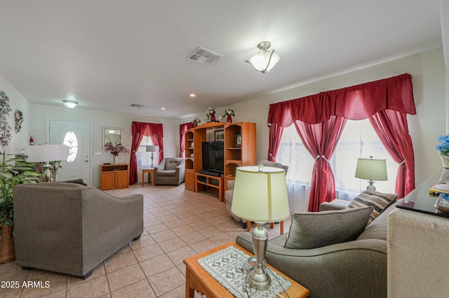 living room with tile patterned floors and visible vents