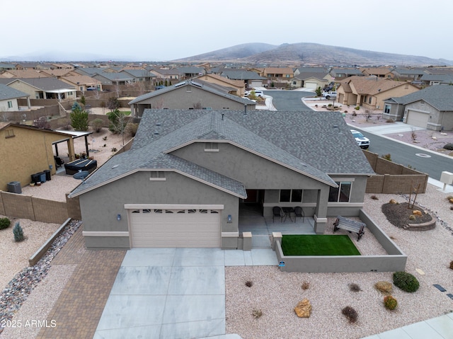 birds eye view of property with a residential view and a mountain view