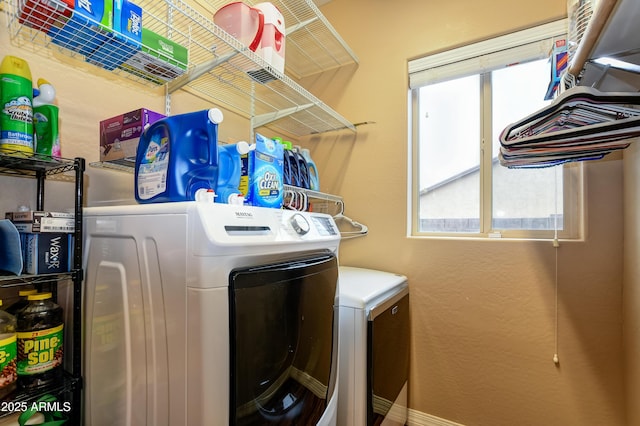 washroom with laundry area and washer and dryer