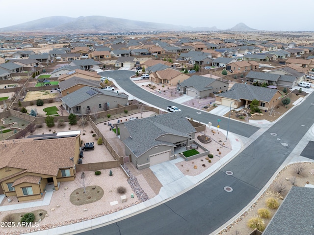 drone / aerial view with a residential view and a mountain view