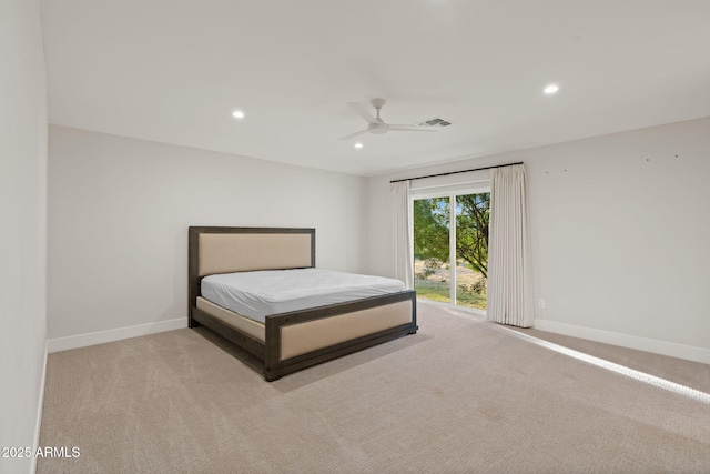 unfurnished bedroom featuring light colored carpet, access to exterior, and ceiling fan