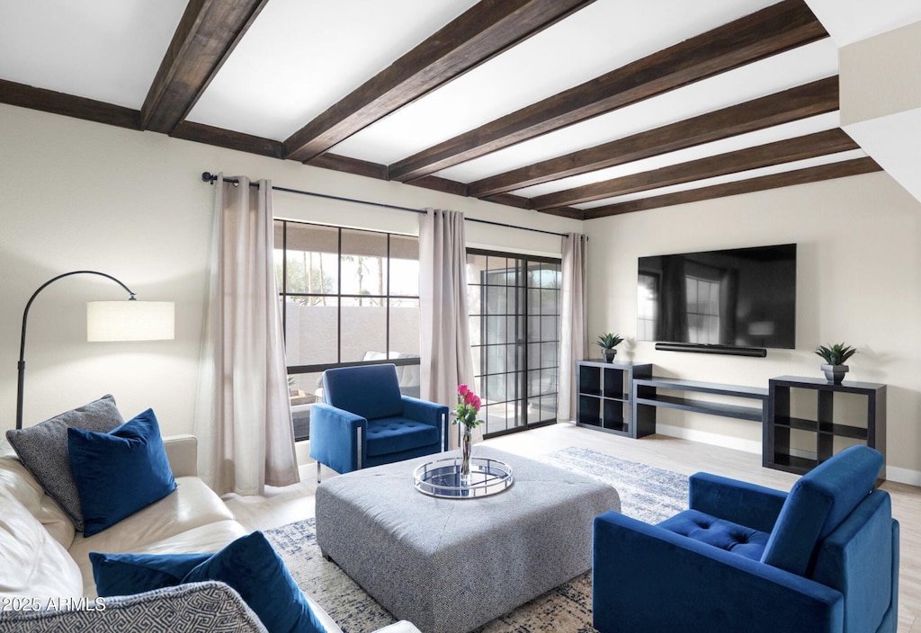 living room with beam ceiling and light hardwood / wood-style flooring