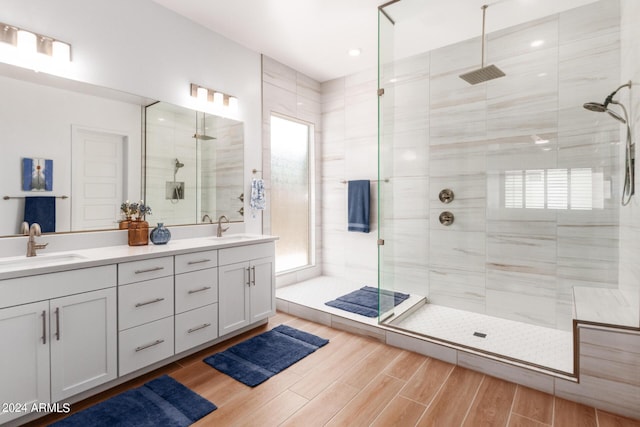 bathroom featuring vanity and a tile shower