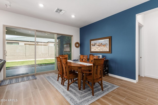 dining space featuring light hardwood / wood-style flooring