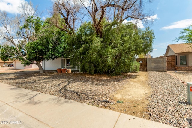 view of front of property featuring a gate and fence
