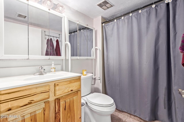 bathroom with toilet, vanity, tile patterned flooring, and a shower with shower curtain